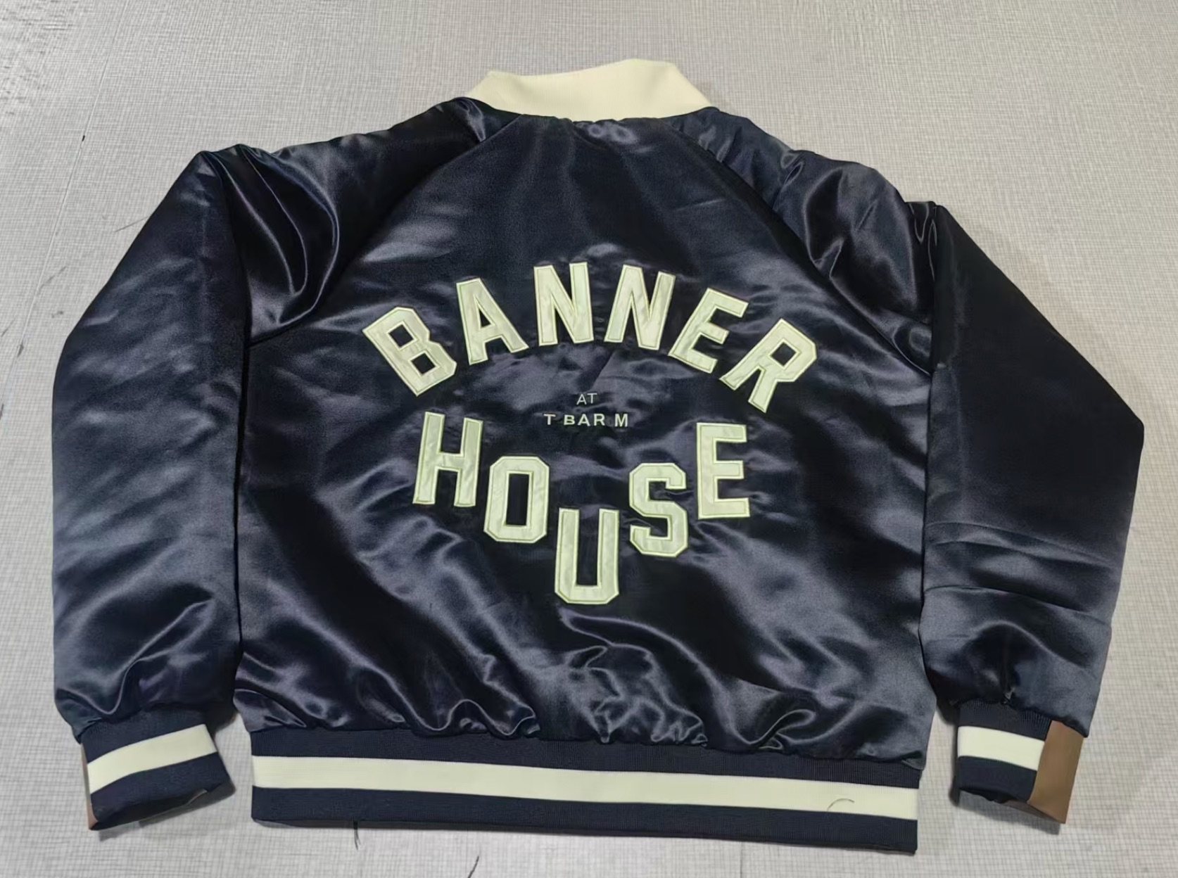 Banner House jacket: custom repeat lining, chenille, appliqué, leather trim and embroidery