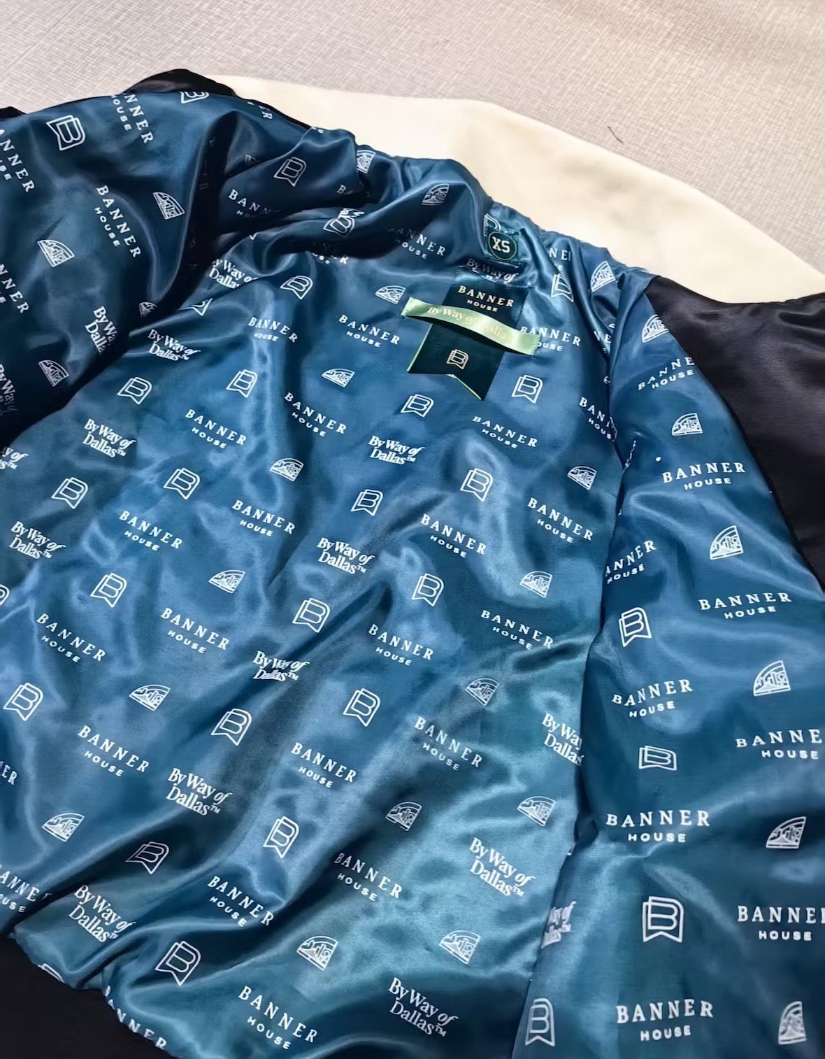 Banner House jacket: custom repeat lining, chenille, appliqué, leather trim and embroidery