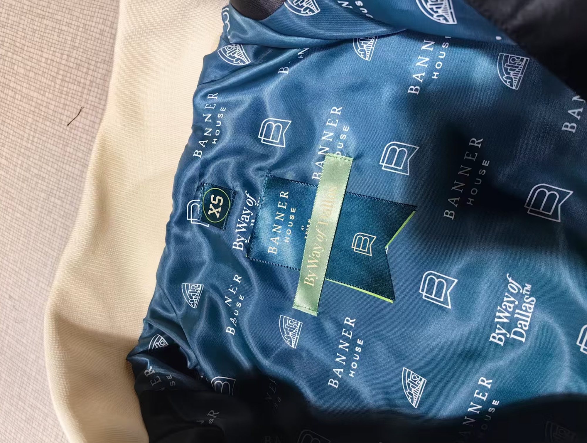 Banner House jacket: custom repeat lining, chenille, appliqué, leather trim and embroidery