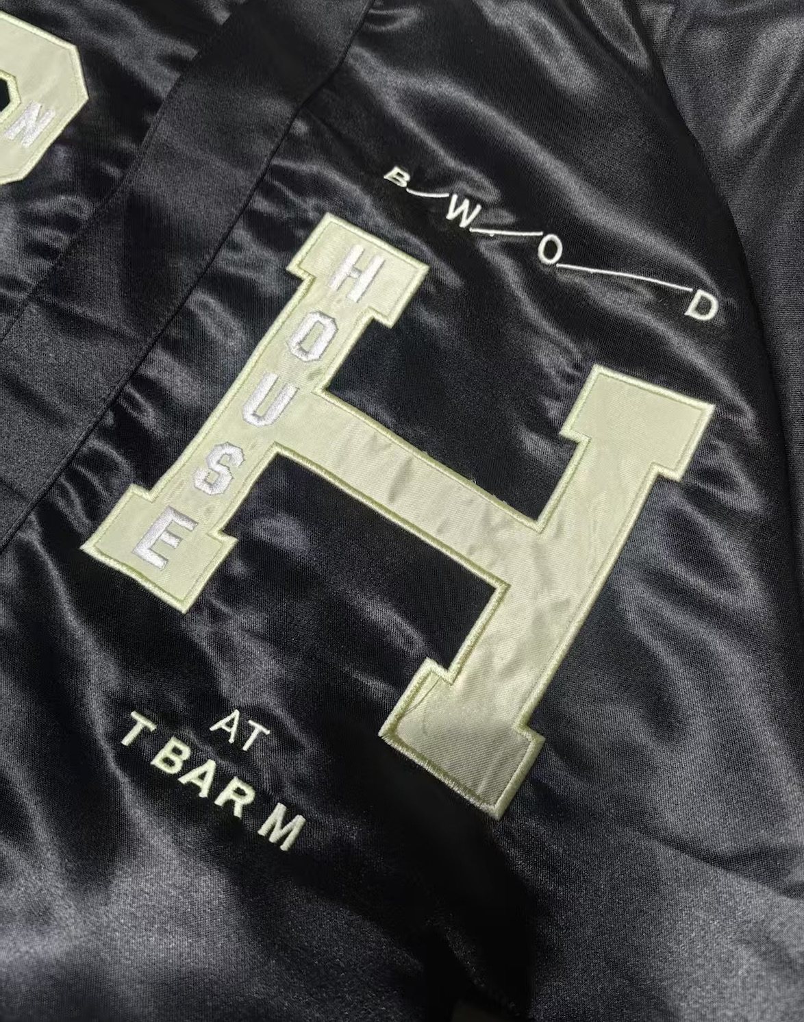 Banner House jacket: custom repeat lining, chenille, appliqué, leather trim and embroidery