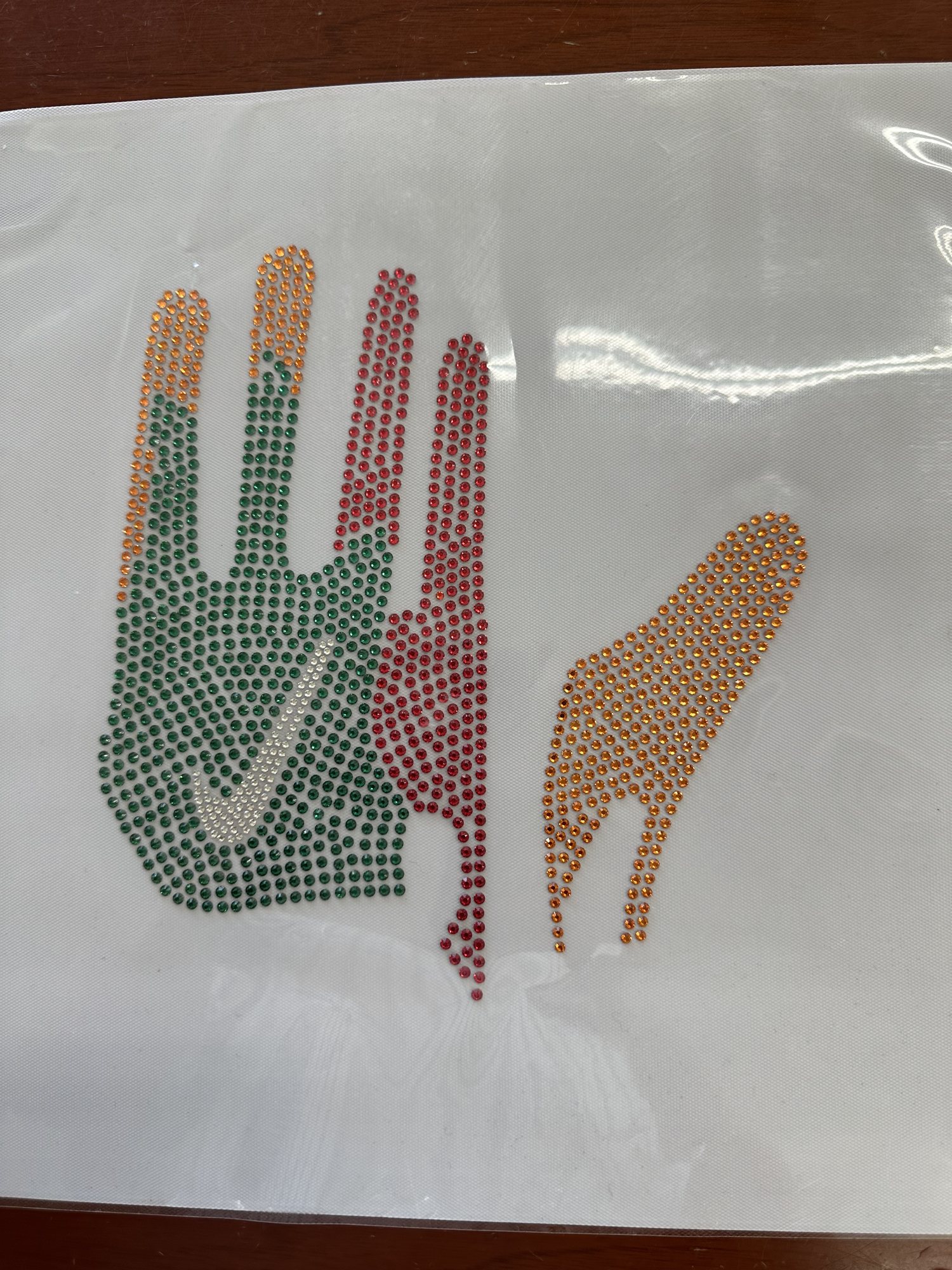 Hand-placed Swarovski crystal receiver gloves, from CAD and pattern to crystal transfer and finished glove