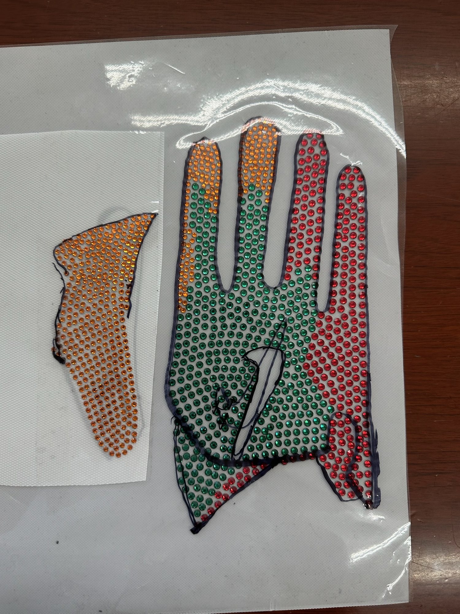 Hand-placed Swarovski crystal receiver gloves, from CAD and pattern to crystal transfer and finished glove