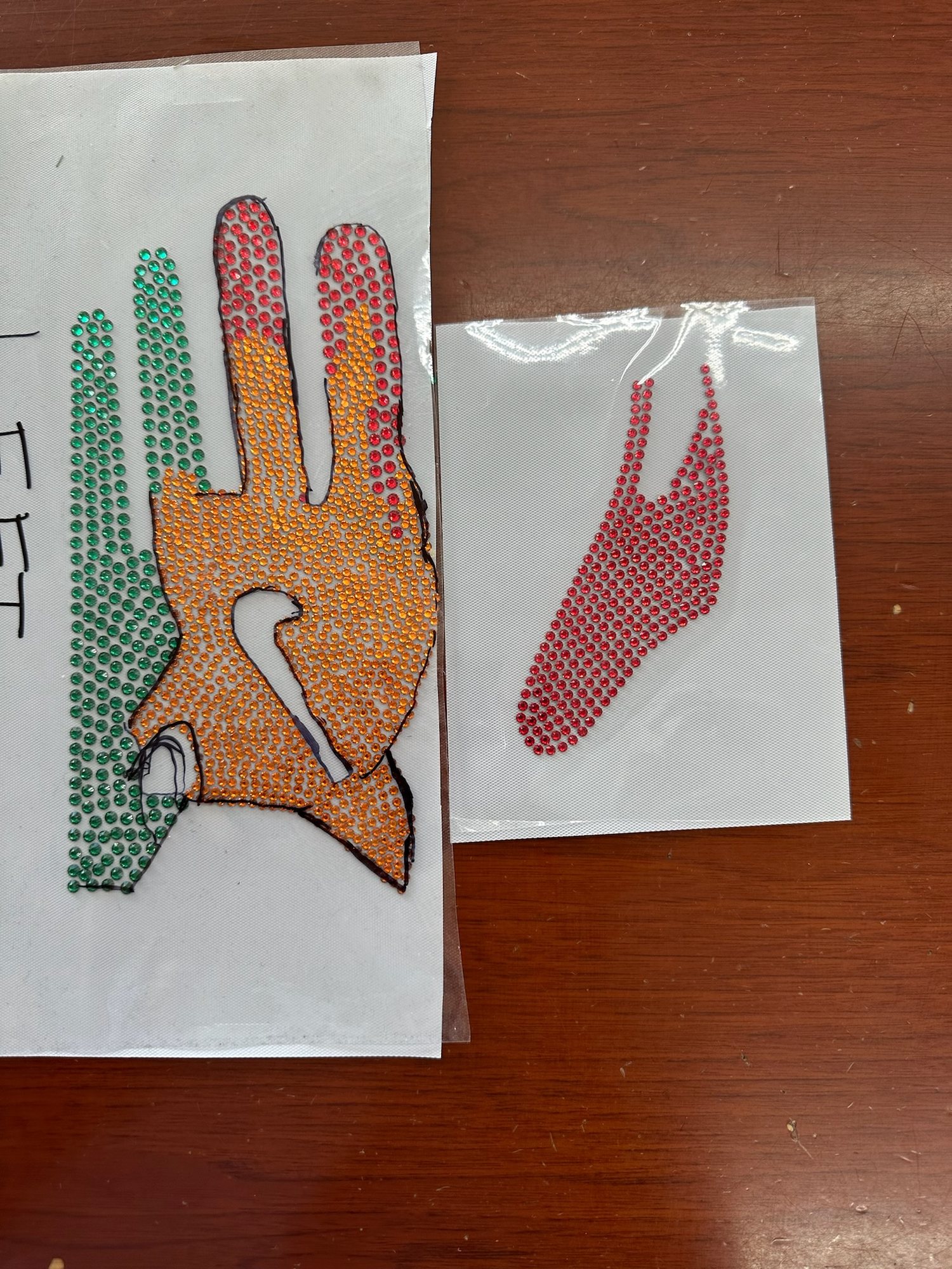 Hand-placed Swarovski crystal receiver gloves, from CAD and pattern to crystal transfer and finished glove