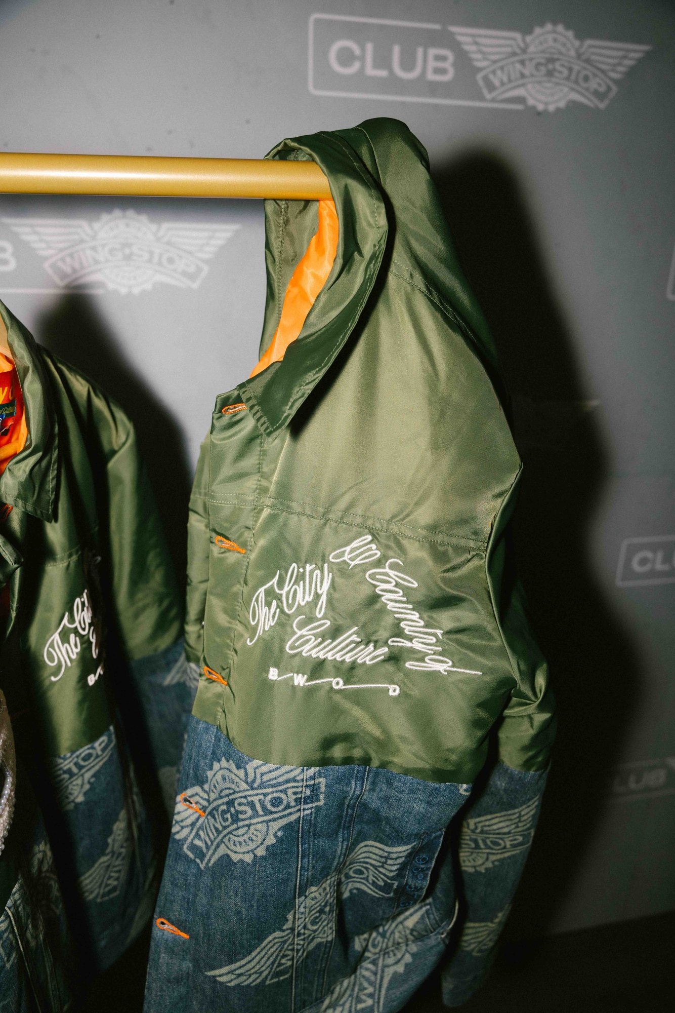 Club Wingstop limited-edition jacket at the launch activation